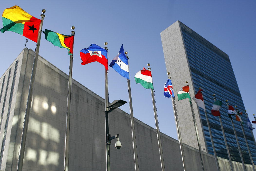 Flags fly high over the United Nations during a sunny day for UN Diplomacy.